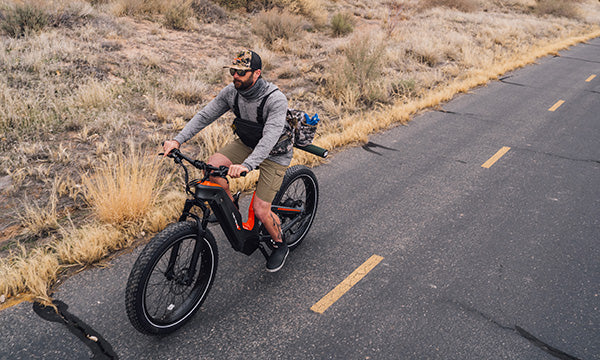 a man is riding Hero carbon all-terrain ebike