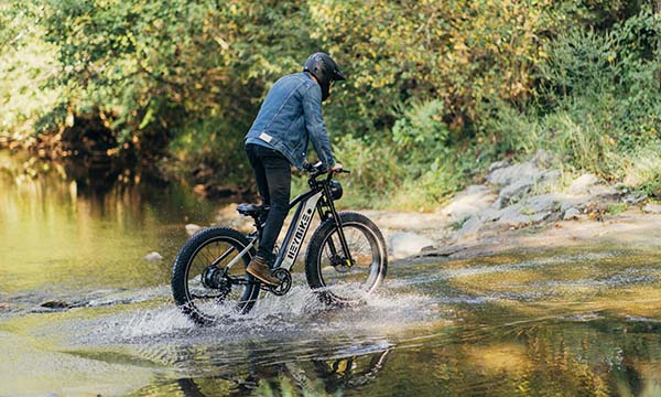 a man is riding fat tire ebike